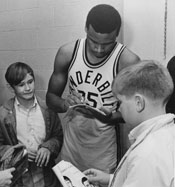 Perry Wallace signs autographs.